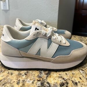 New Balance 237 Cream and Blue Athletic Shoes